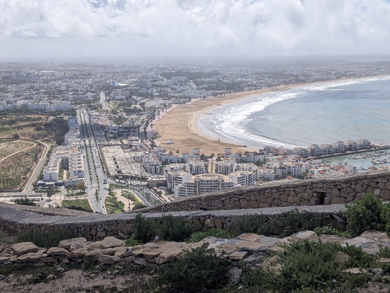 The broad sandy beach and Atlantic seafront promenade of Agadir, Morocco