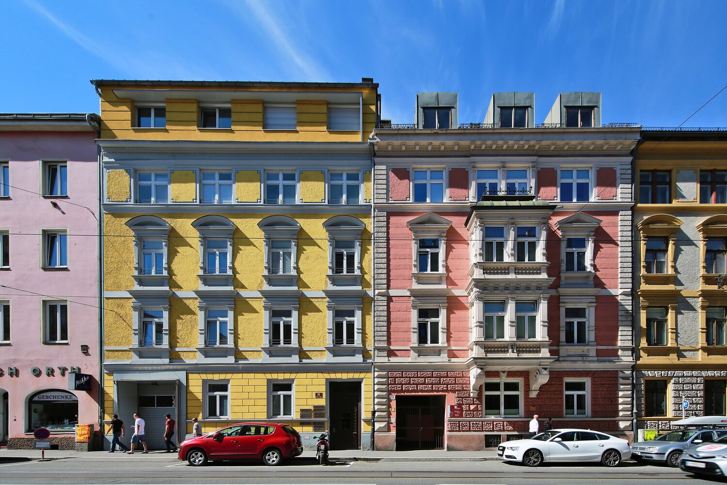 Innsbruck's Golden Roof and colourful old town facades with the Nordkette mountain range rising directly behind