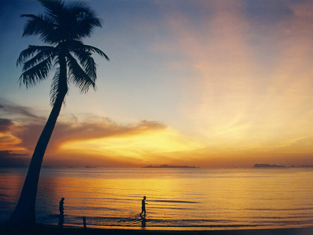 A palm-fringed beach on the Gulf of Thailand island of Koh Samui