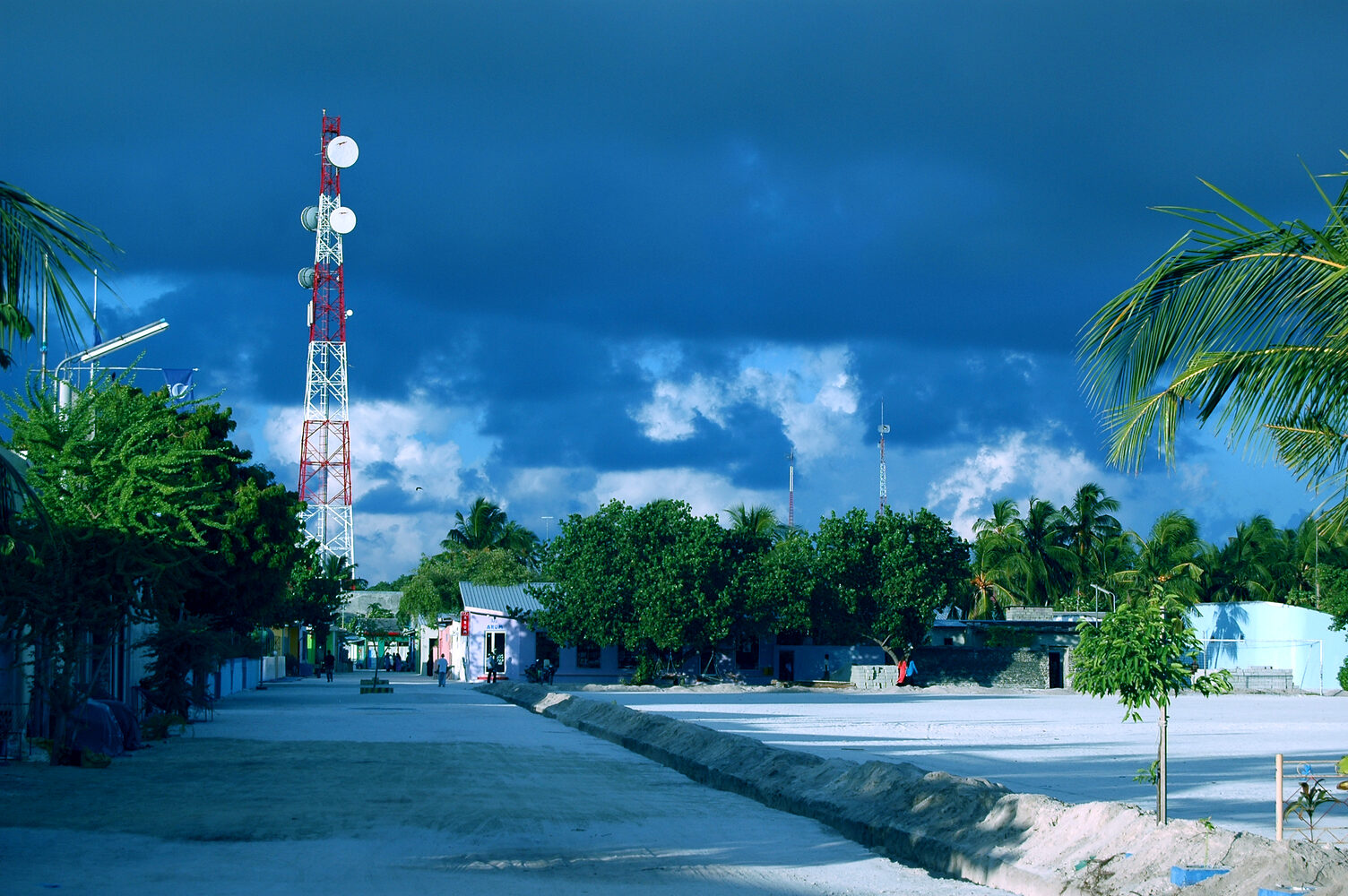 A quiet beach lined with guesthouses on the local island of Maafushi, Maldives