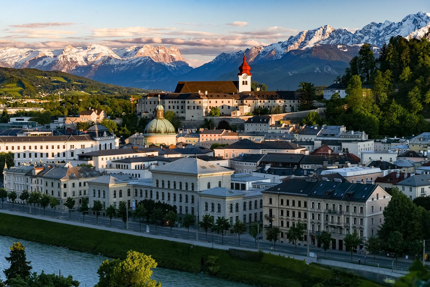 The Hohensalzburg fortress above the baroque old town of Salzburg with the Alps in the background