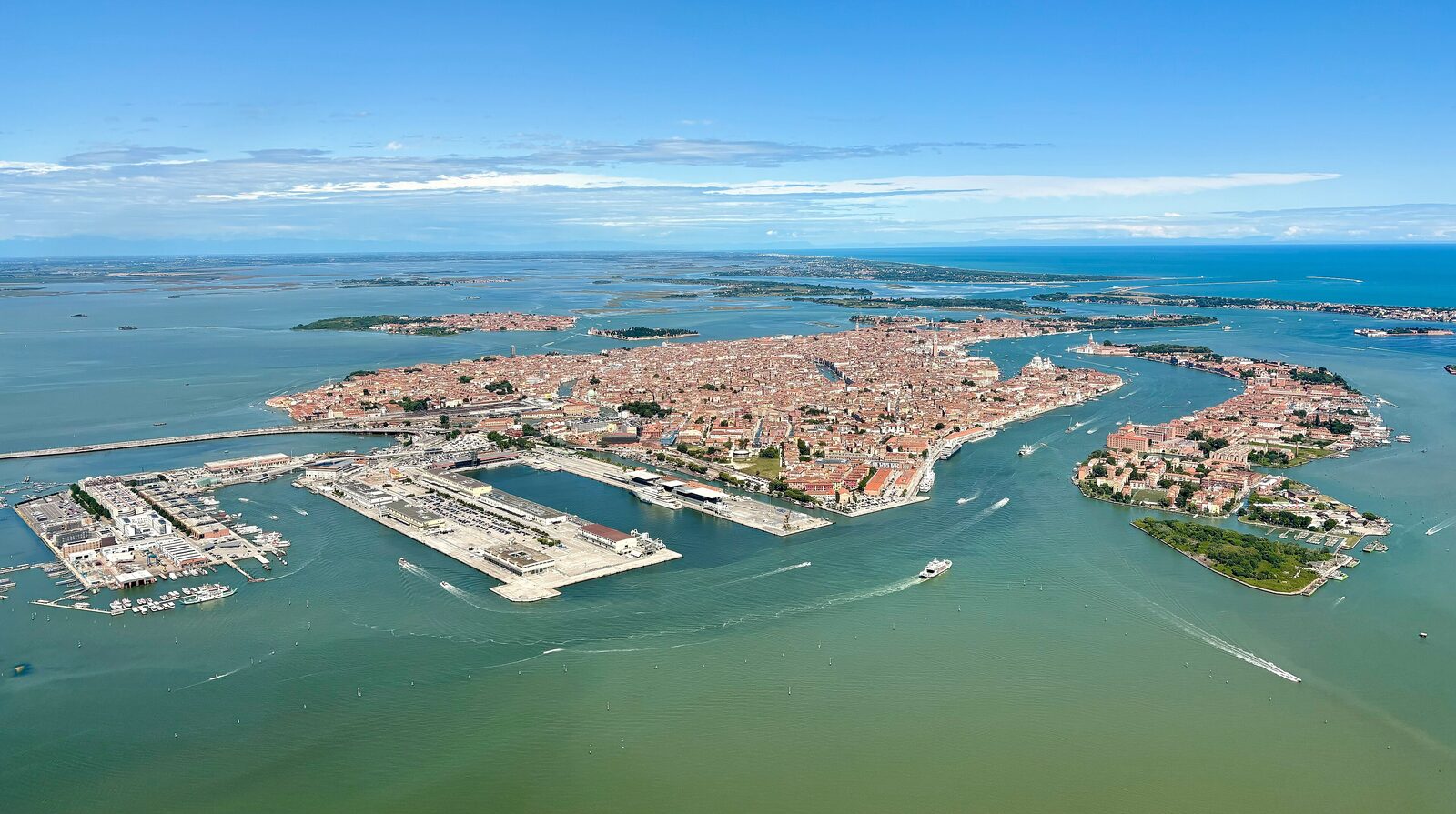 Venice's Grand Canal lined with historic palazzos and gondolas in the morning light